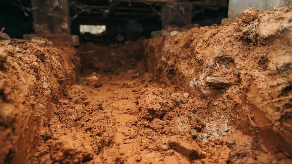 Georgia red clay soil around foundation plumbing in Roswell