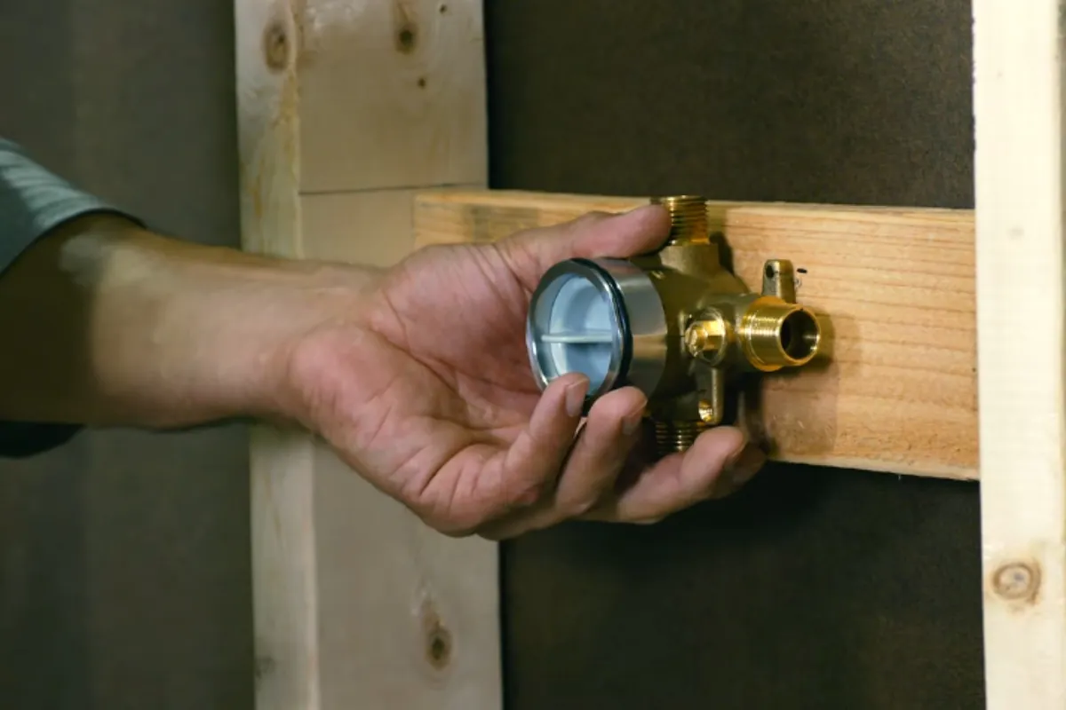 Pressure-balance shower valve rough-in before tile in a Roswell, GA bathroom remodel